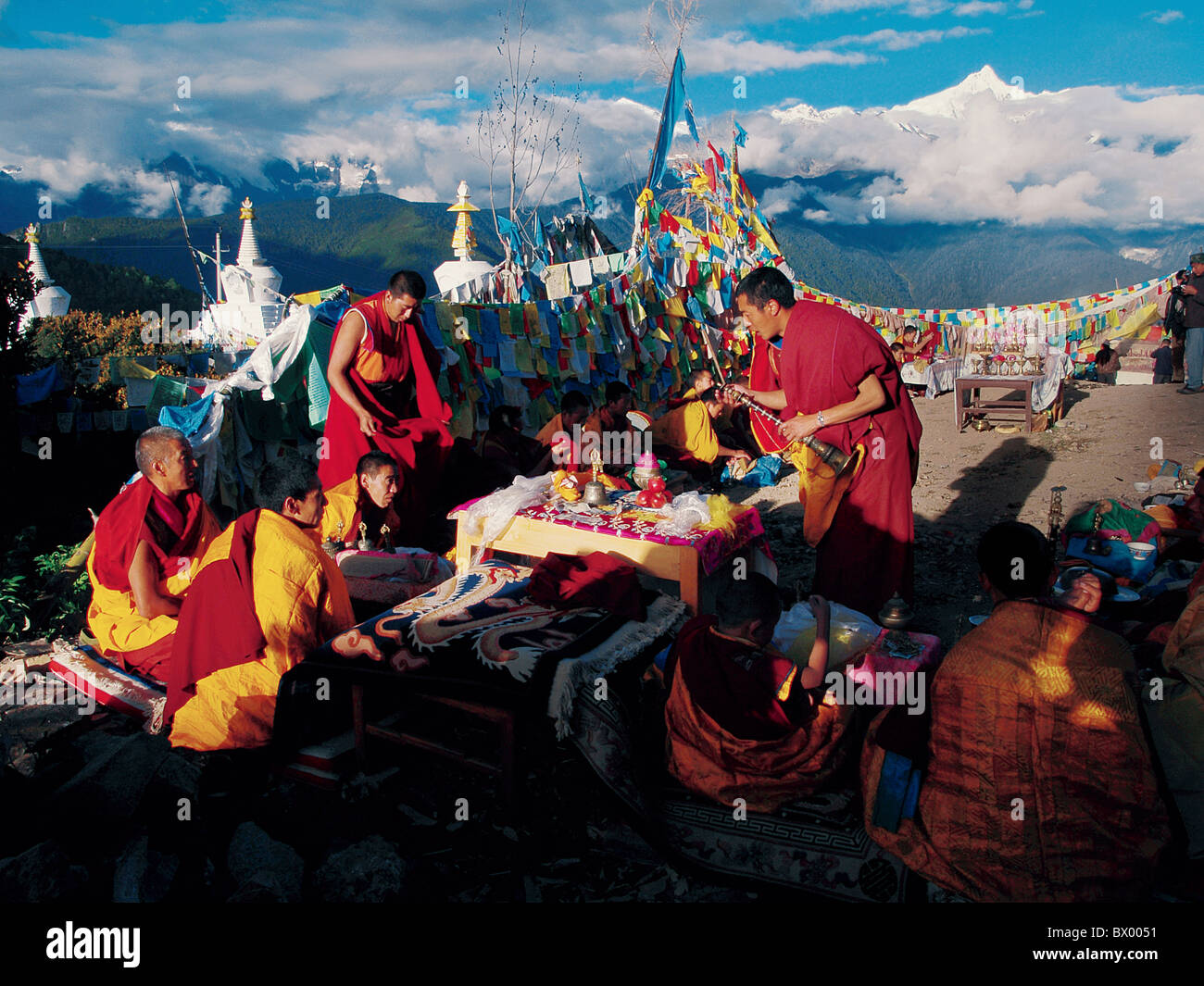 Tibetan Buddhist monks preparing for a religious ritual before Meili ...
