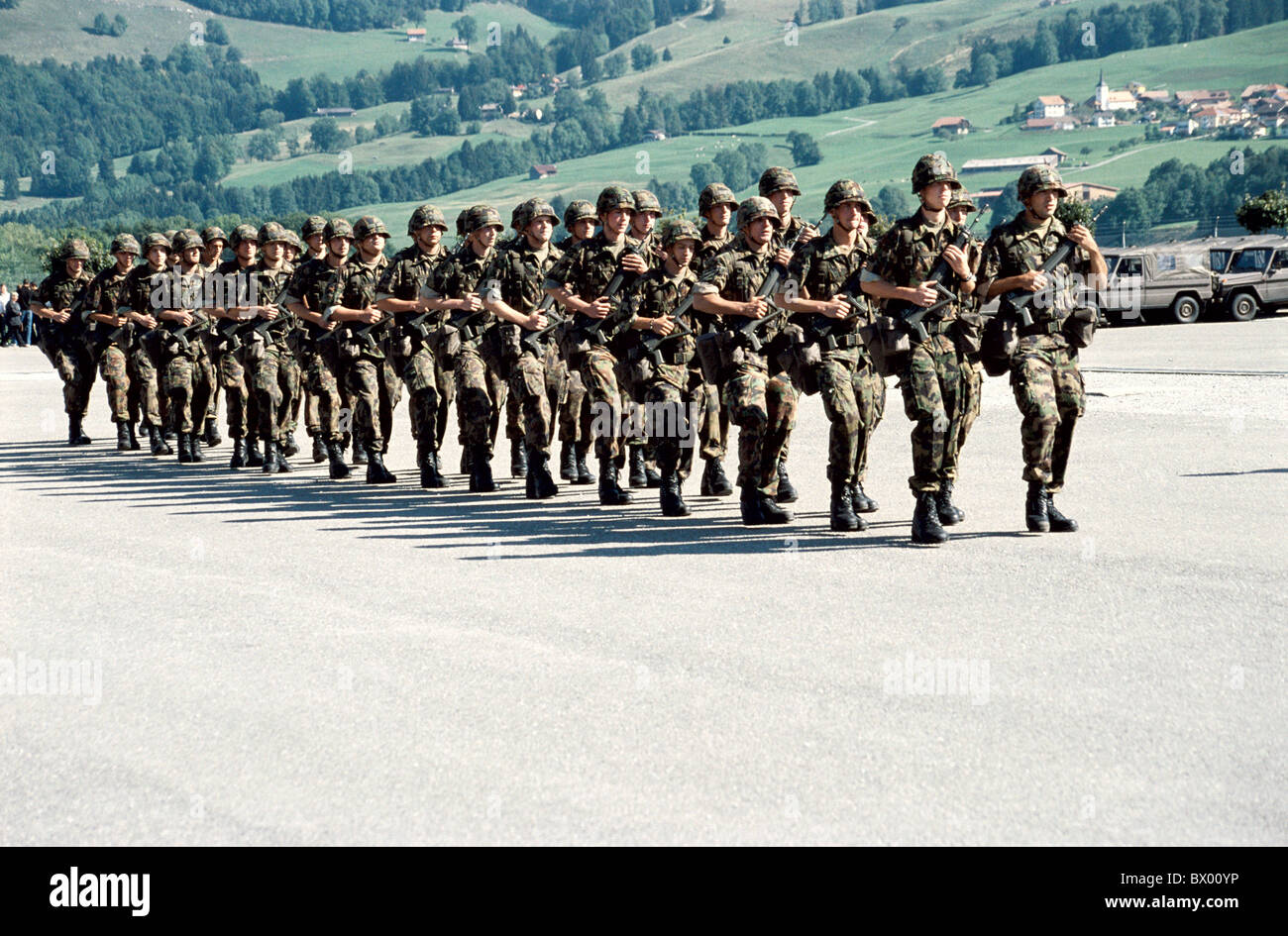 army military group men marsh march marching military no model release Switzerland Europe soldier unifor Stock Photo