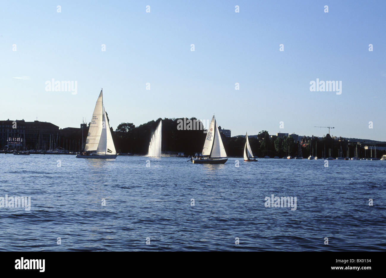 evening light narrowness Switzerland Europe sail boats sail sailing ships fountains town city