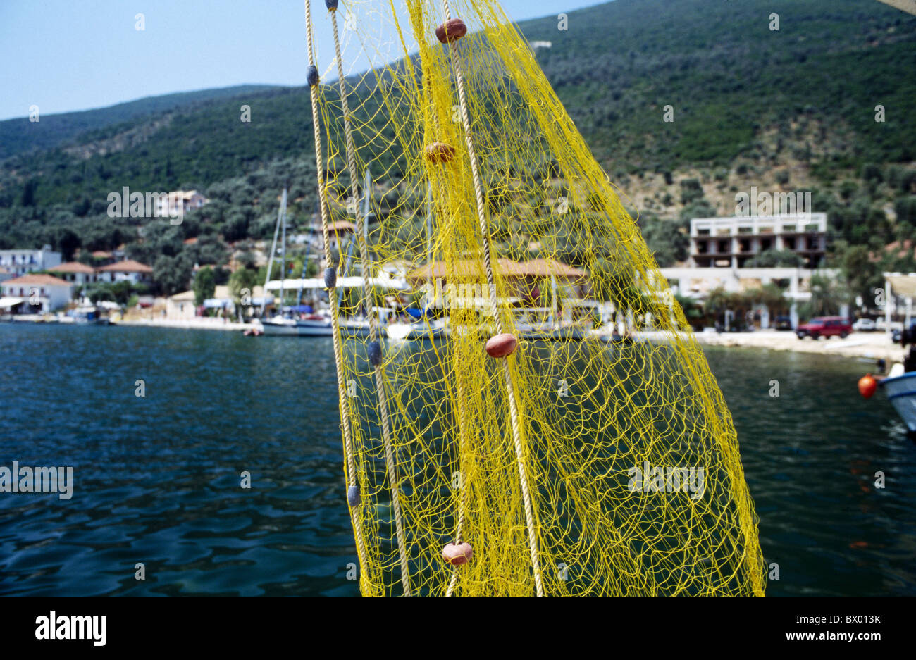 hung up fishing village fishing fishery fishing net fishing yellow Greece sea Stock Photo