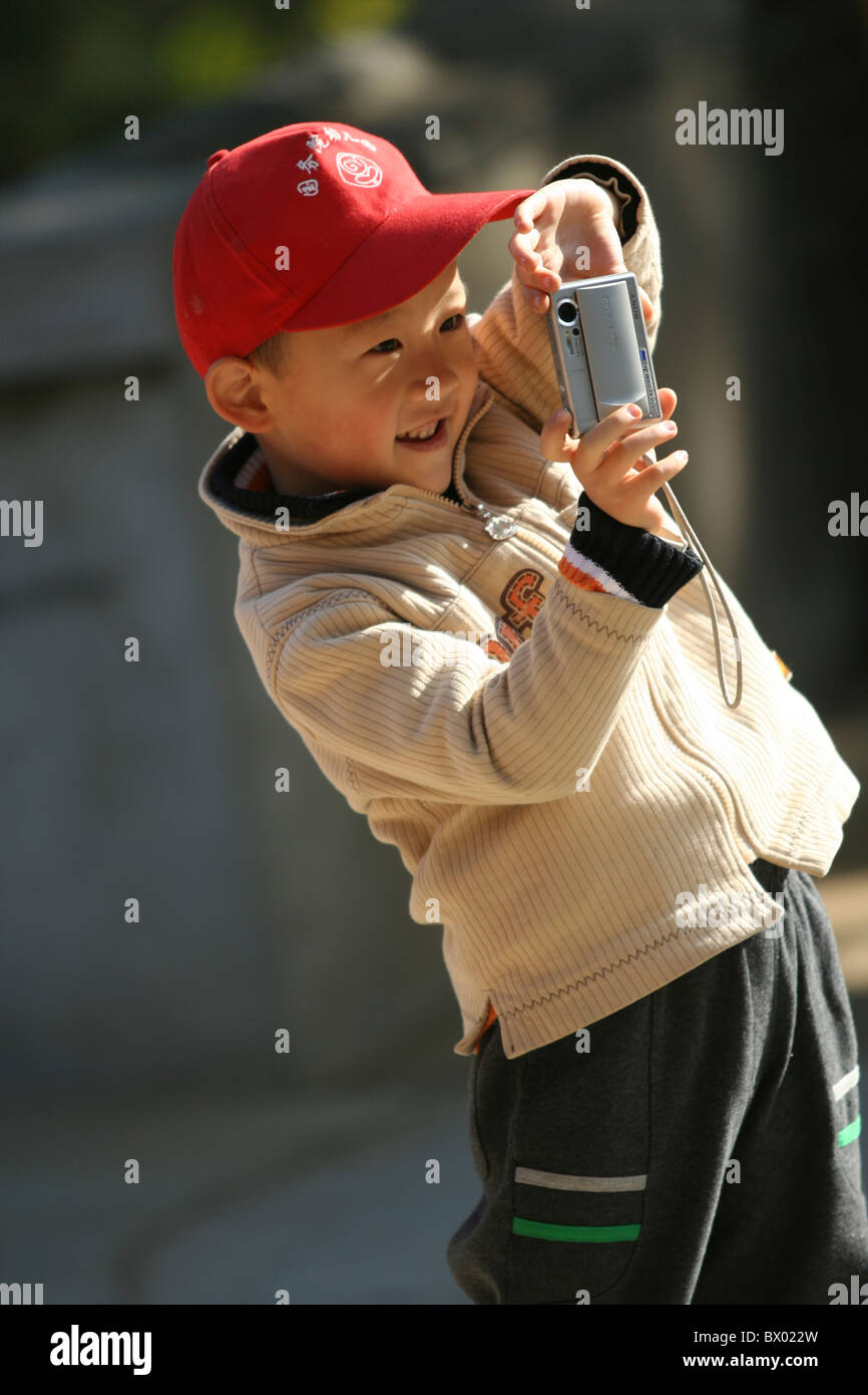Chinese boy taking photos, Badachu Park, Beijing, China Stock Photo