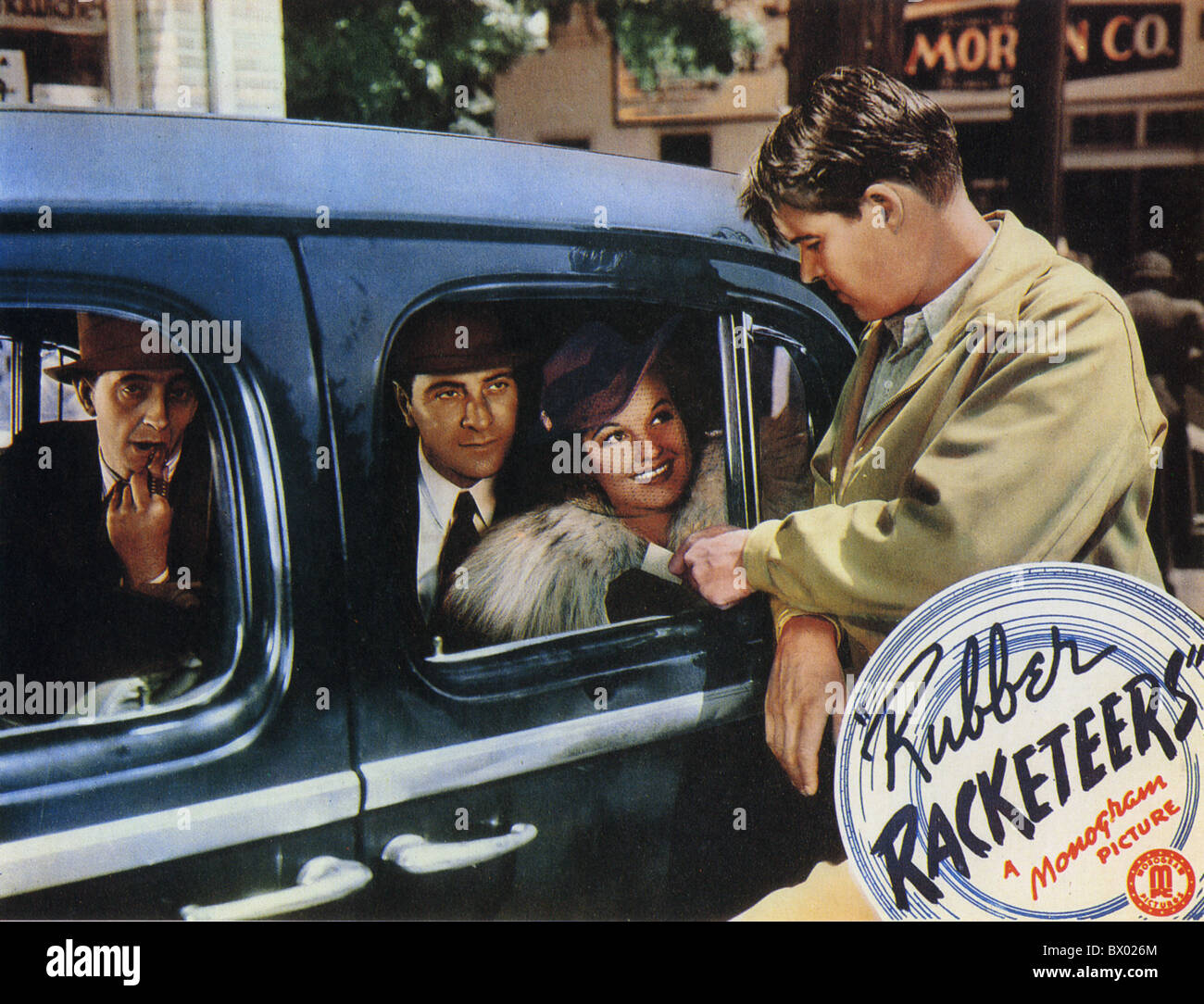RUBBER RACKETEERS Poster for 1942 Monogram film with Ricardo Cortez at left and in the car Rochelle Hudson Stock Photo