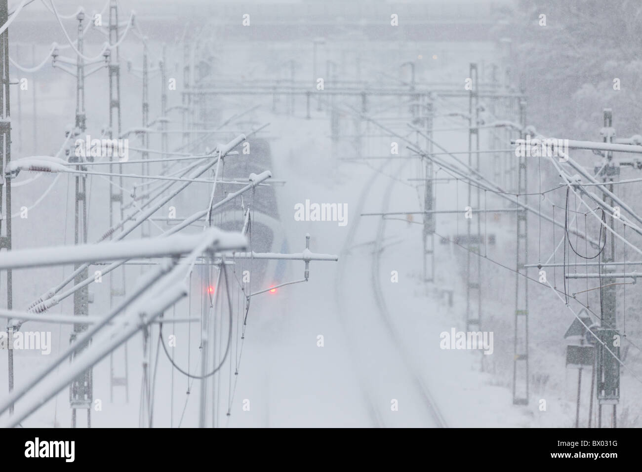 Train passing through winter landscape Stock Photo