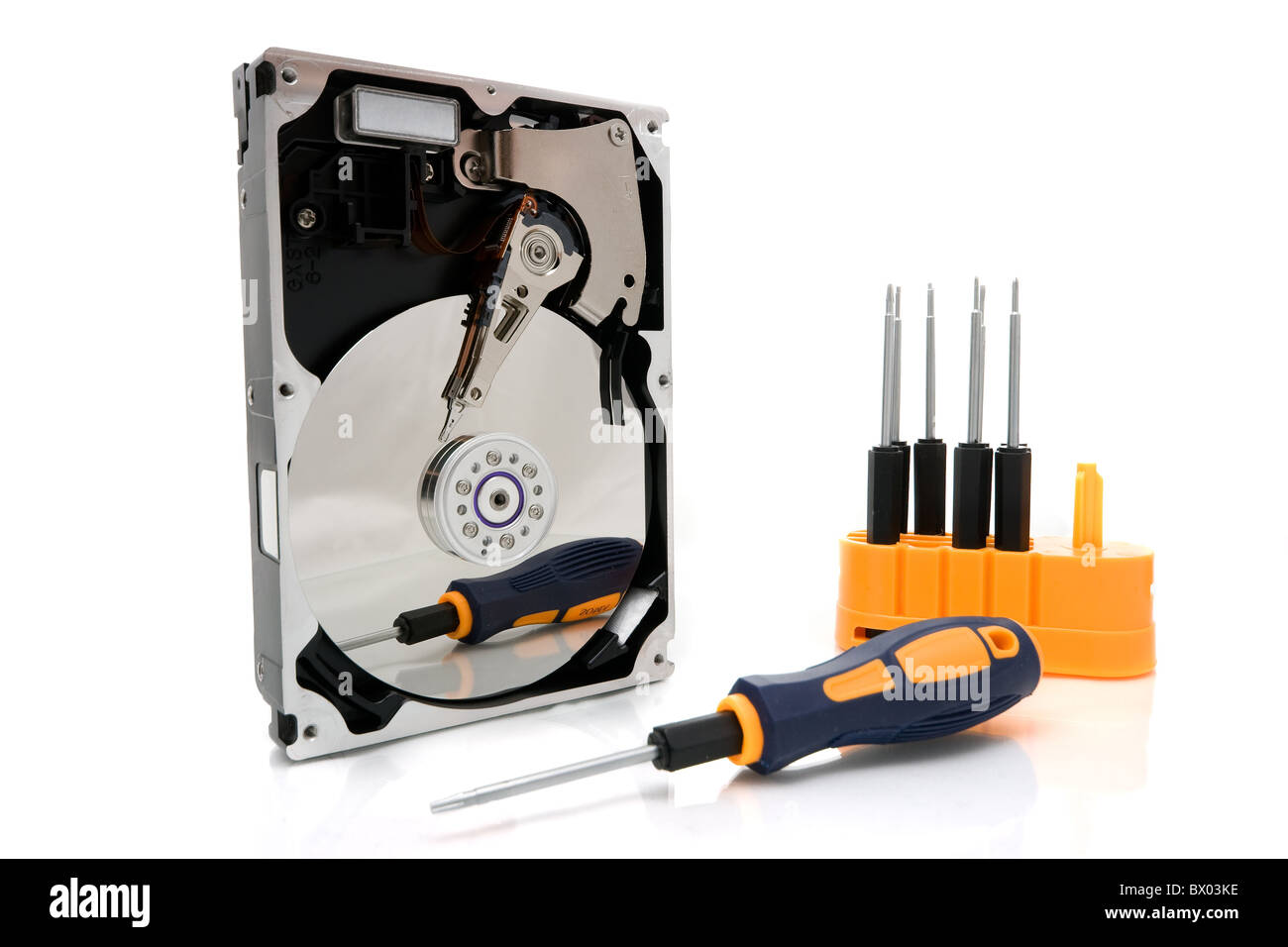 Front cover open Hard Disk Device with a set of screwdrivers in the