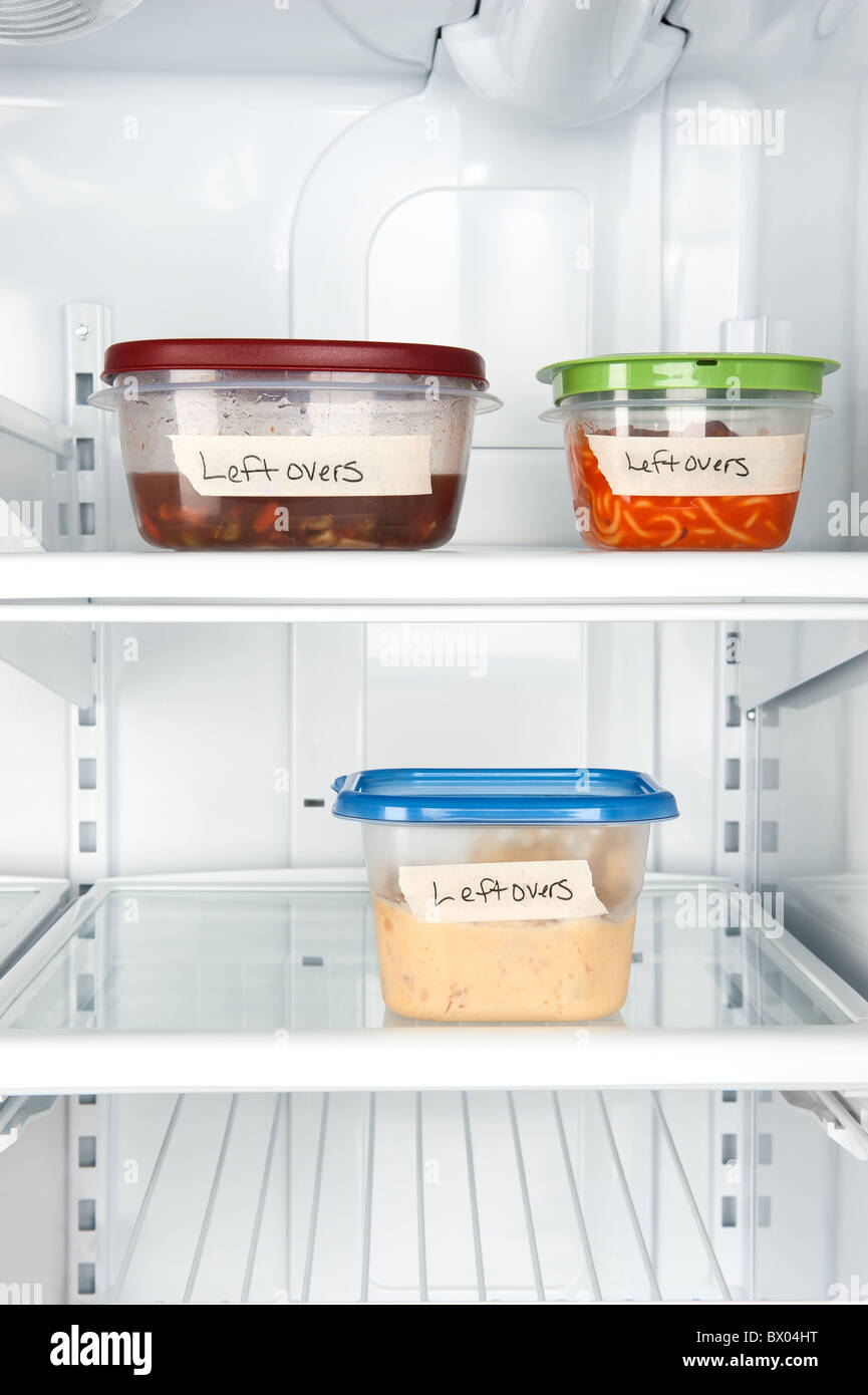 Leftover containers of food in a refrigerator for use with many food inferences. Stock Photo
