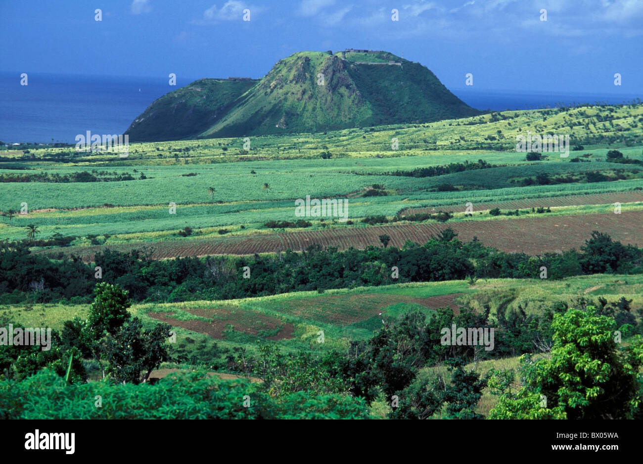 Brimstone Hill coast green Saint Kitts scenery landscape sea Caribbean to fields volcano cones Stock Photo