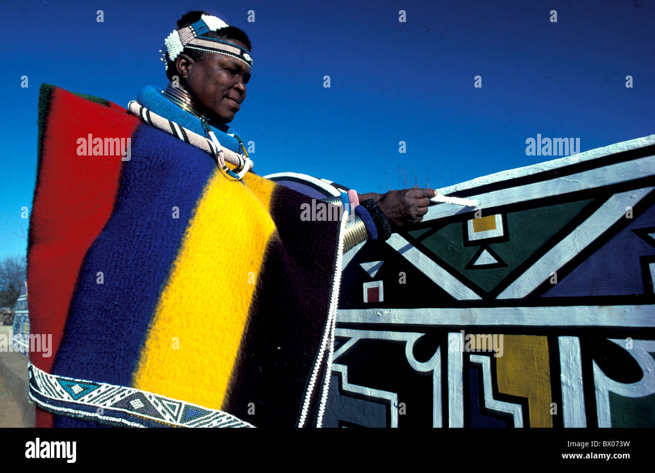 Africa costume jewellery jewelry malend man Ndebele Village no model release painting South Africa Stock Photo