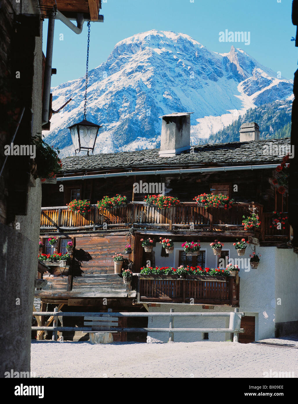 Switzerland Europe Valais Grimentz village cutting part timber house floral decoration mountain Val de Moiry Stock Photo