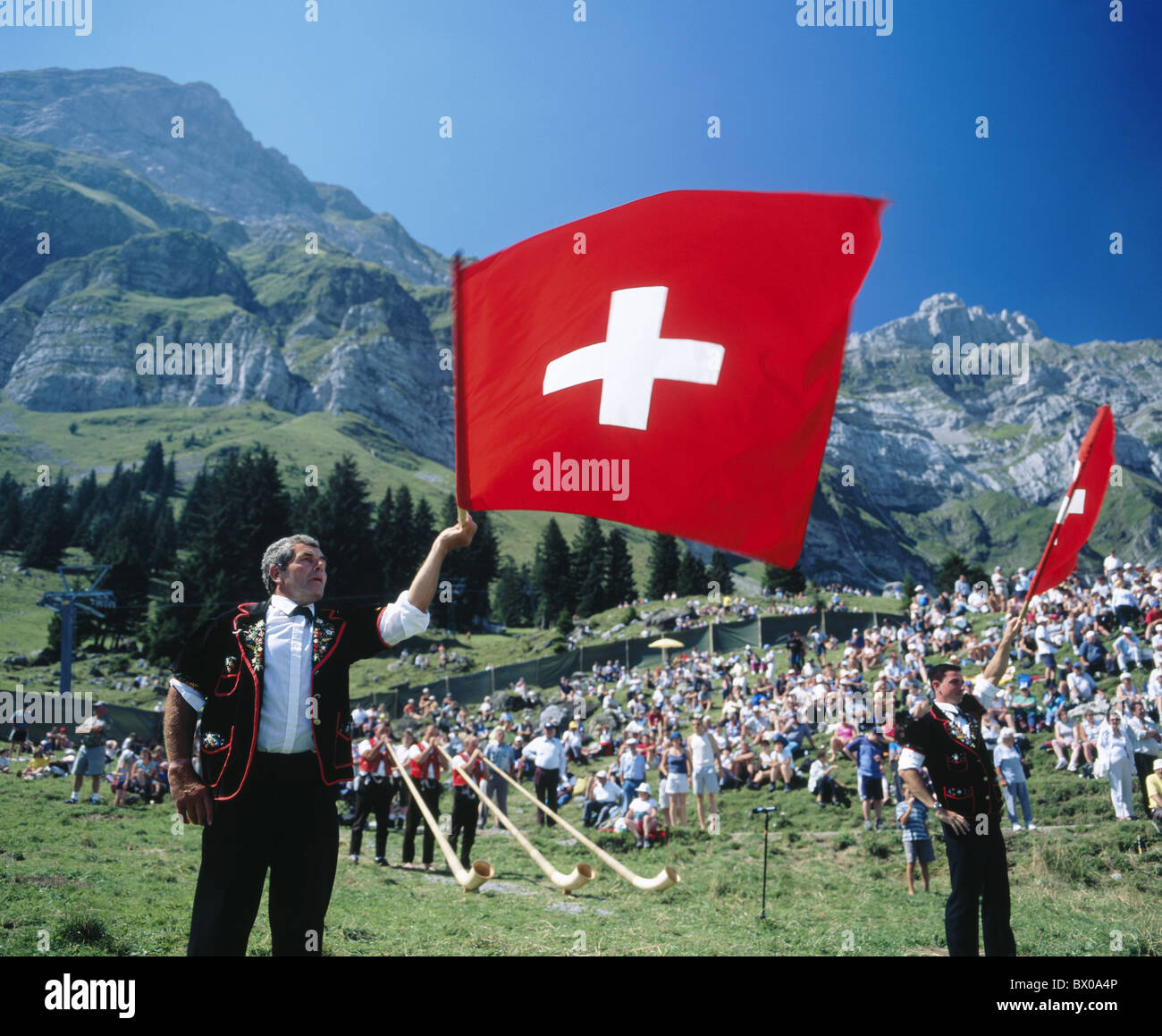 alp horn blower alp horn flag throwing flags swing folklore Eastern Switzerland tradition Switzerland Euro Stock Photo