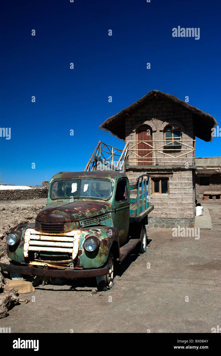 Salt block house and old pick-up truck, the village of Colchani, Salar de Uyuni salt flat in Bolivia. Stock Photo