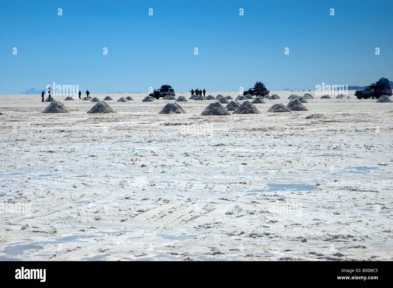 Heaps of salt for harvest on the Salar de Uyuni salt flats, Bolivia. Stock Photo