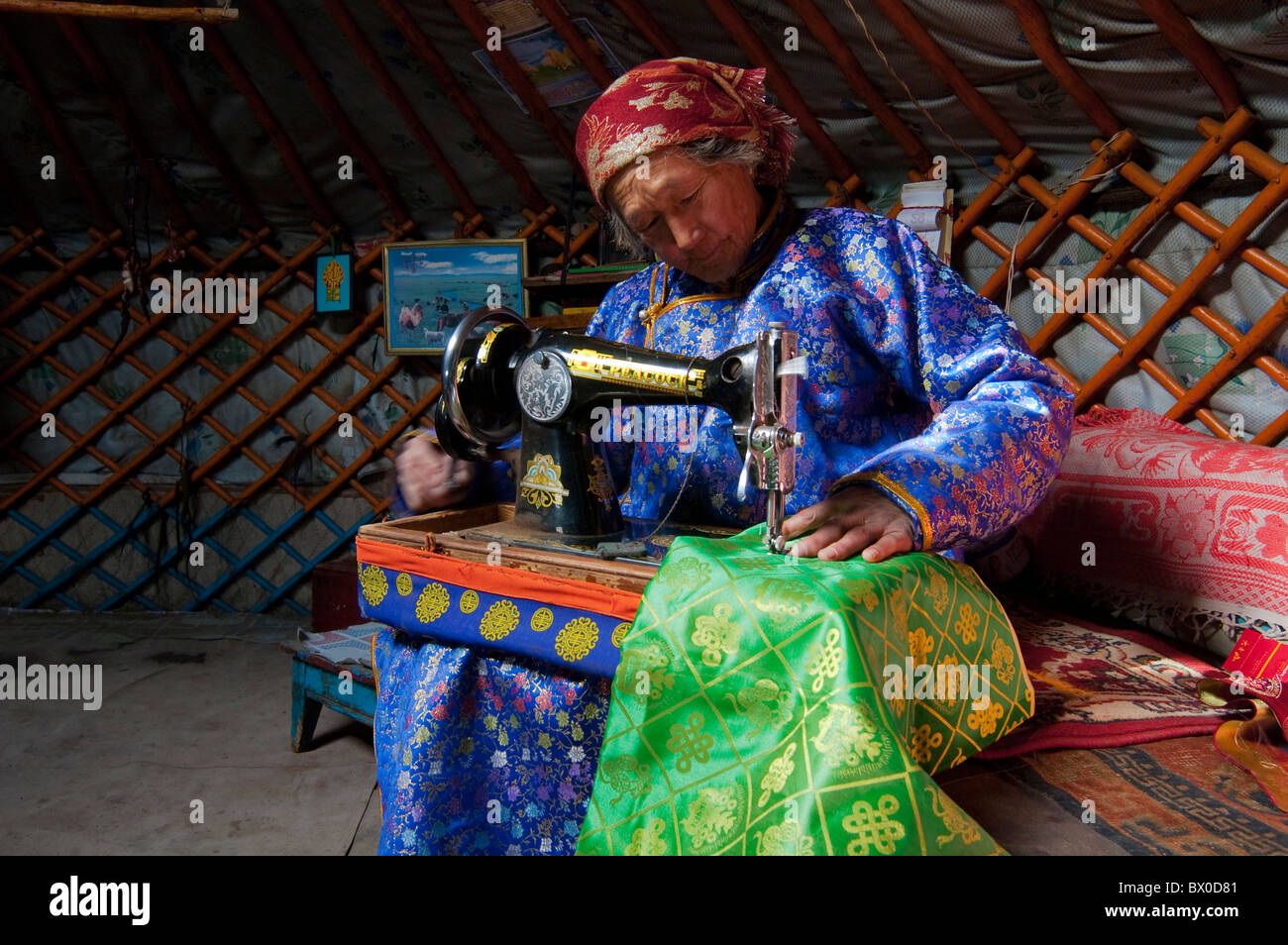 Elderly Barag Mongolian woman sewing, Old Barag Banner, Hulunbuir