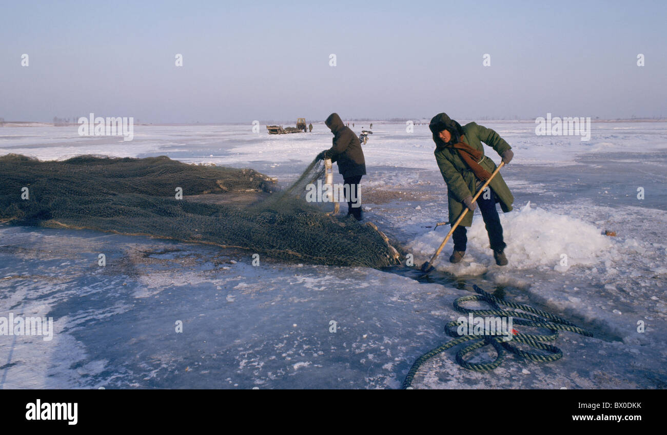 Fishermen gathering fish net during Winter Fishing, Dorbod Mongol