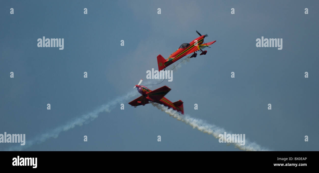 Two Morroccan Air Force planes CAP 231 Green March La Marche Verte doing aerobatic display just in the process of a cross-over Stock Photo