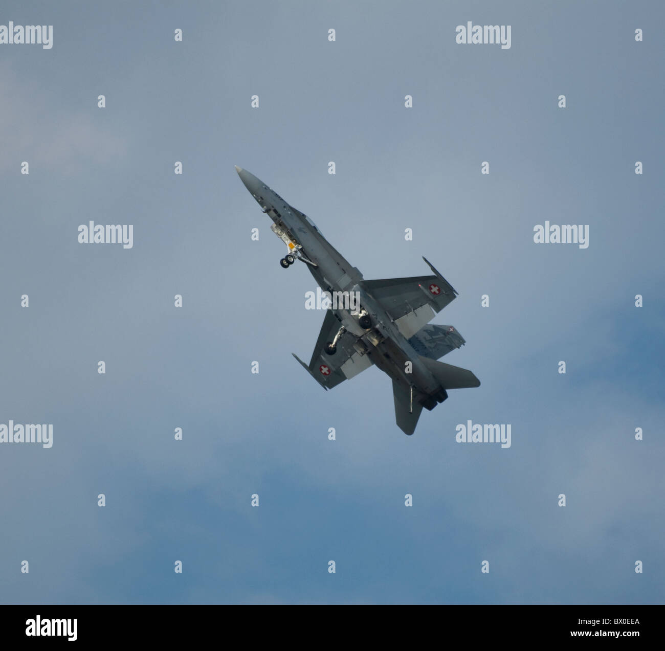 Swiss F/A-18C Hornet  climbing steeply into sky showing undercarriage under side Stock Photo