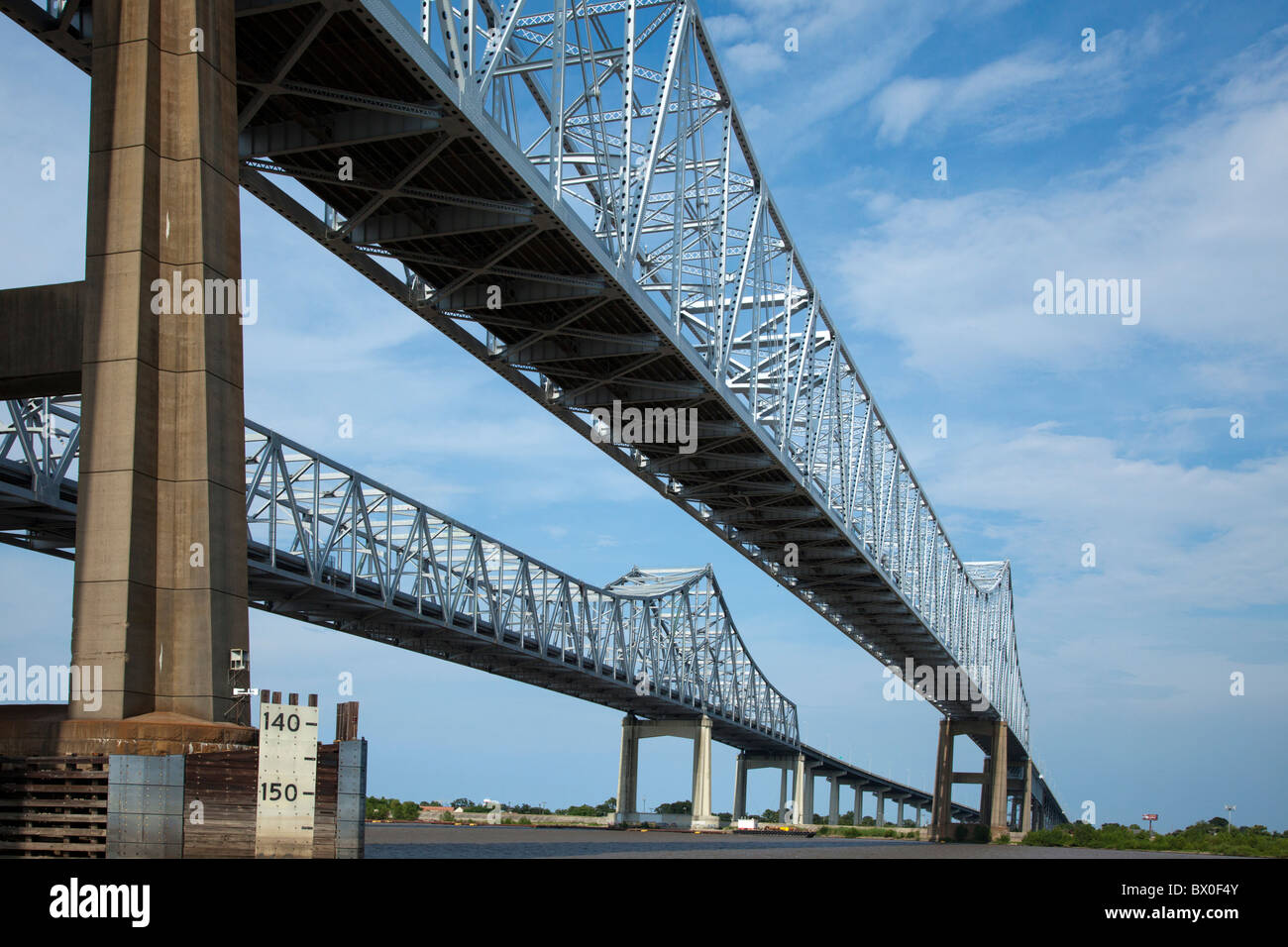 The Crescent City Connection (formerly the Greater New Orleans Bridge) are twin cantilever bridges spanning the Mississipi River Stock Photo