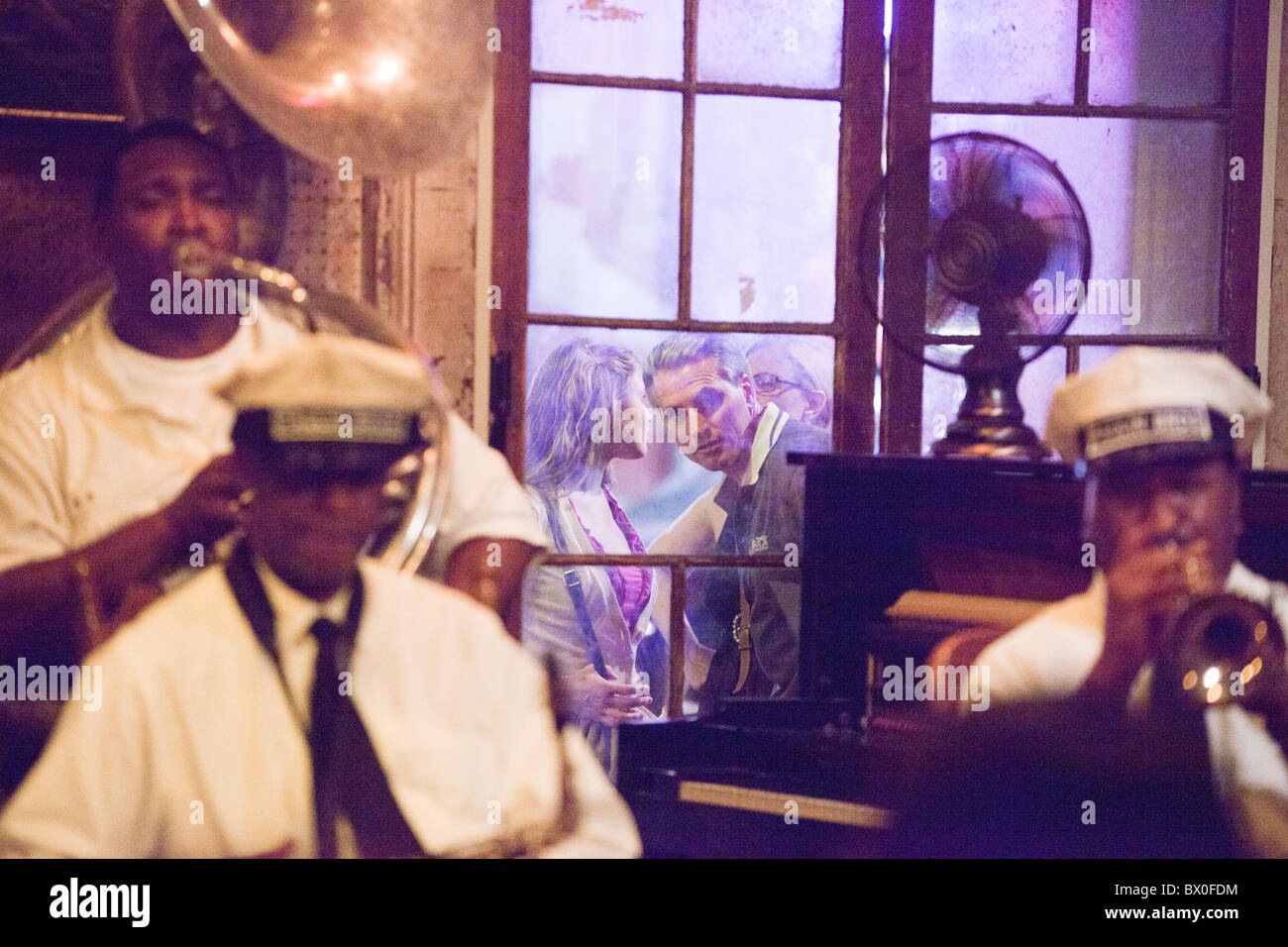 The Paulin Brothers Brass Band plays at Preservation Hall in New Orleans, Louisiana, as tourists