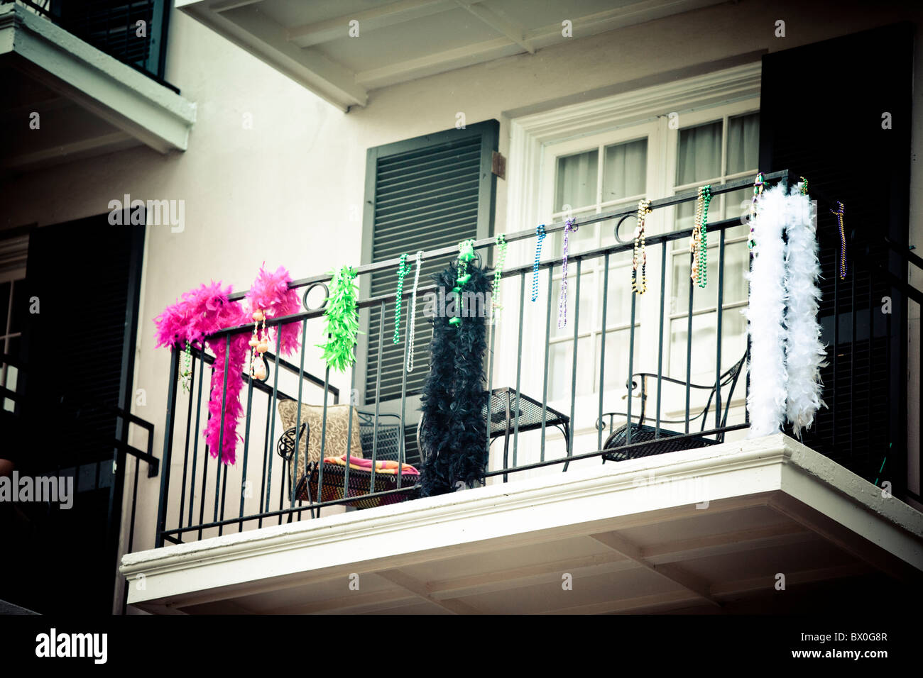 Mardi Gras beads decorate a balcony on Bourbon Street in New Orleans