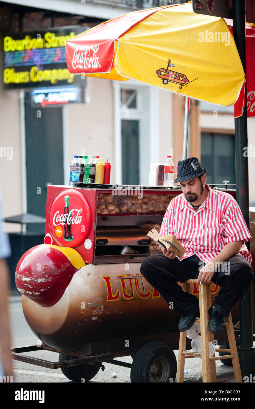 A man sells lucky hot dogs on Bourbon Street in New Orleans, Louisiana
