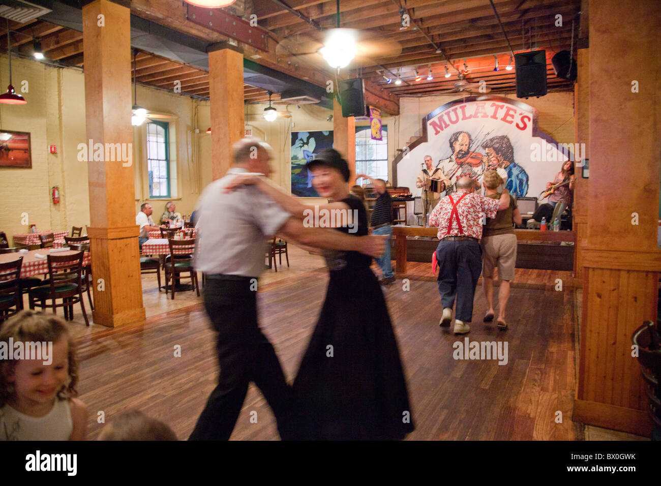 Diners take a moment to dance to Jonno Frishberg's band at Mulate's, a