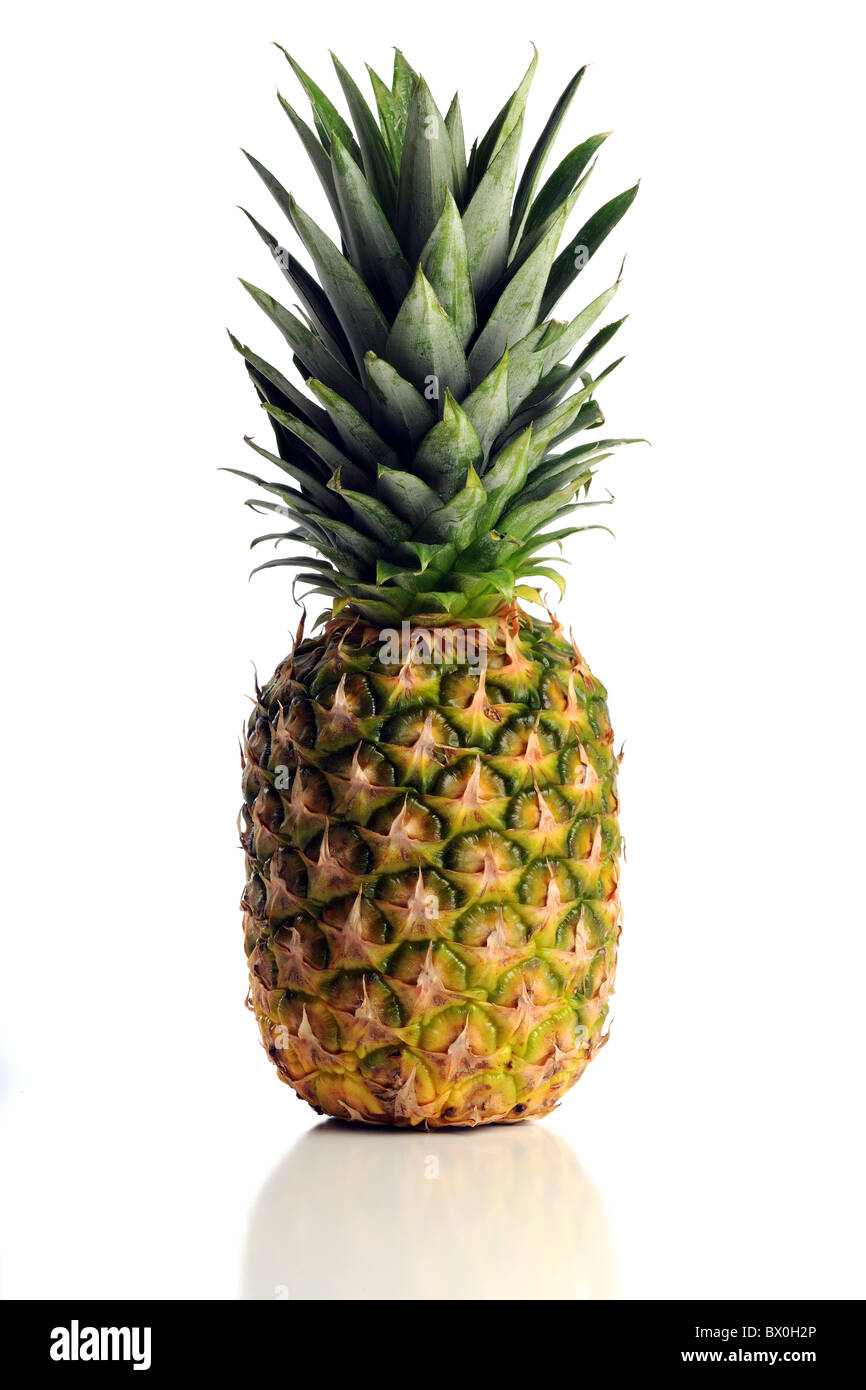 Fresh pineapple isolated over white background with reflection on table Stock Photo
