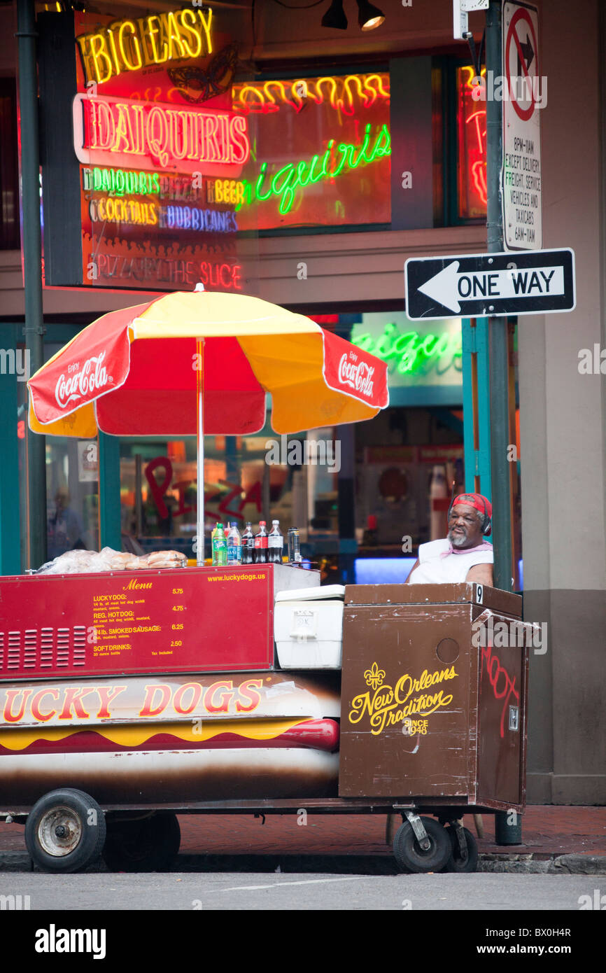 A man sells hot dogs on New Orleans, Louisiana's famed Bourbon Street