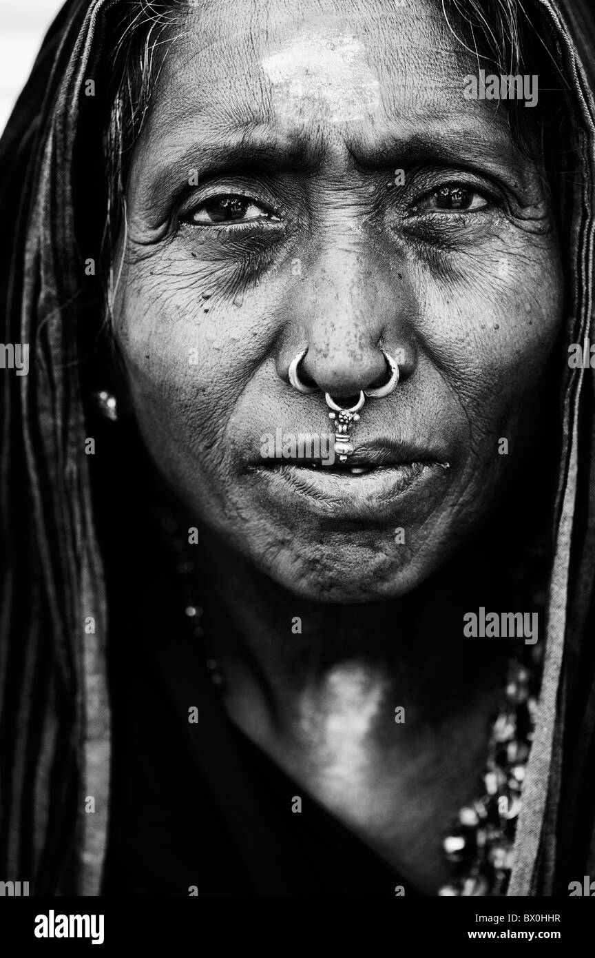 Old Indian woman on Ayappa pilgrimage in Puttaparthi, Andhra Pradesh, India. Monochrome Stock Photo