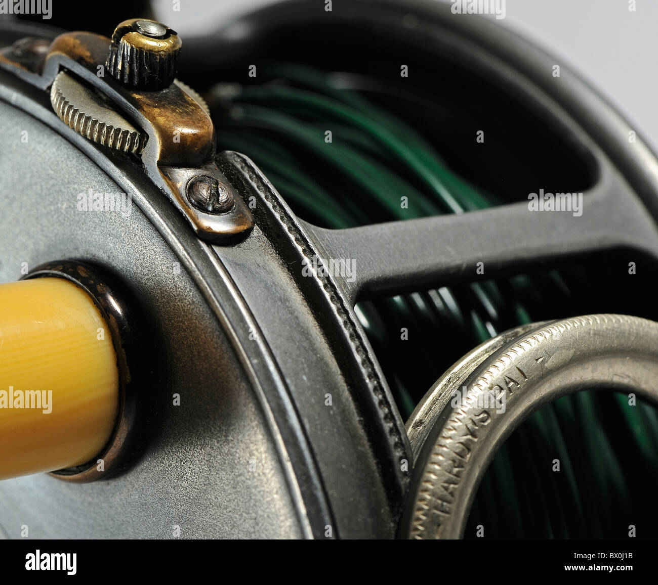Hardy Perfect antique Salmon fly fishing reel detail against a plain white  background Stock Photo - Alamy