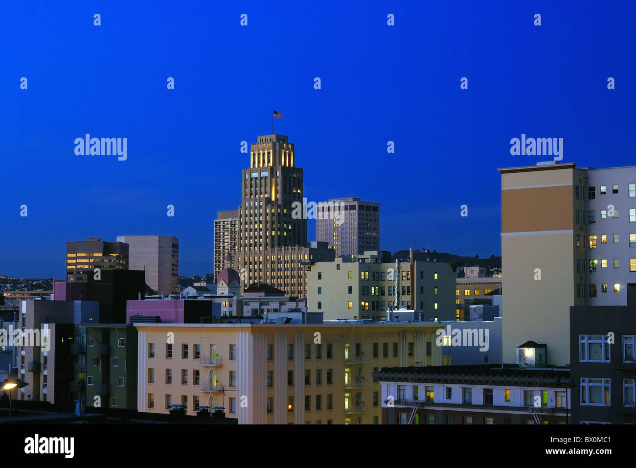 An american metropolitan city fuilly lit at dawn Stock Photo
