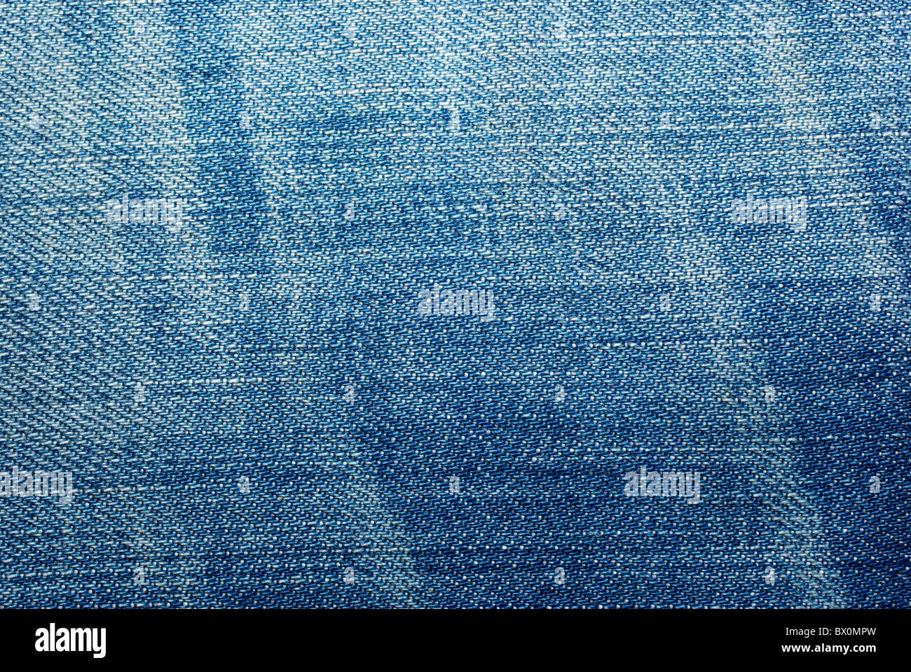 Blue worn jeans cloth textured abstract background Stock Photo - Alamy