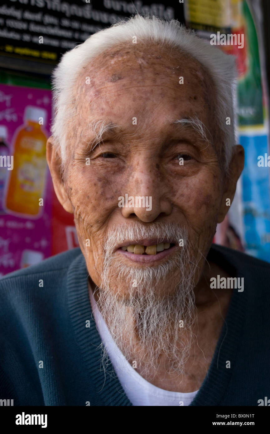 An elderly Asian man with white hair and a long goatee is smiling in Mae  Hong Son, Thailand Stock Photo - Alamy
