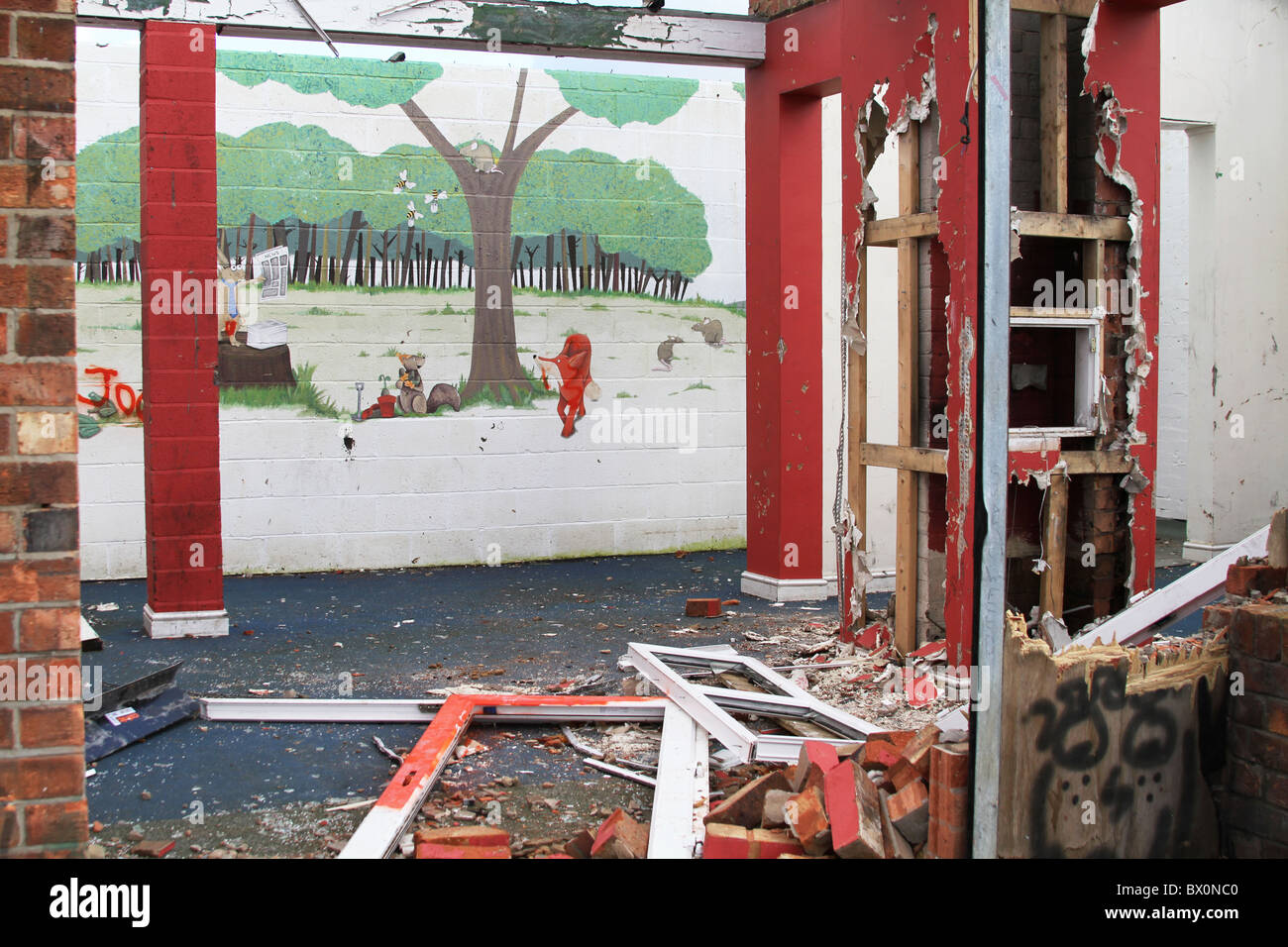 Inside view of seriously damaged children's play room on council park premises. Stock Photo