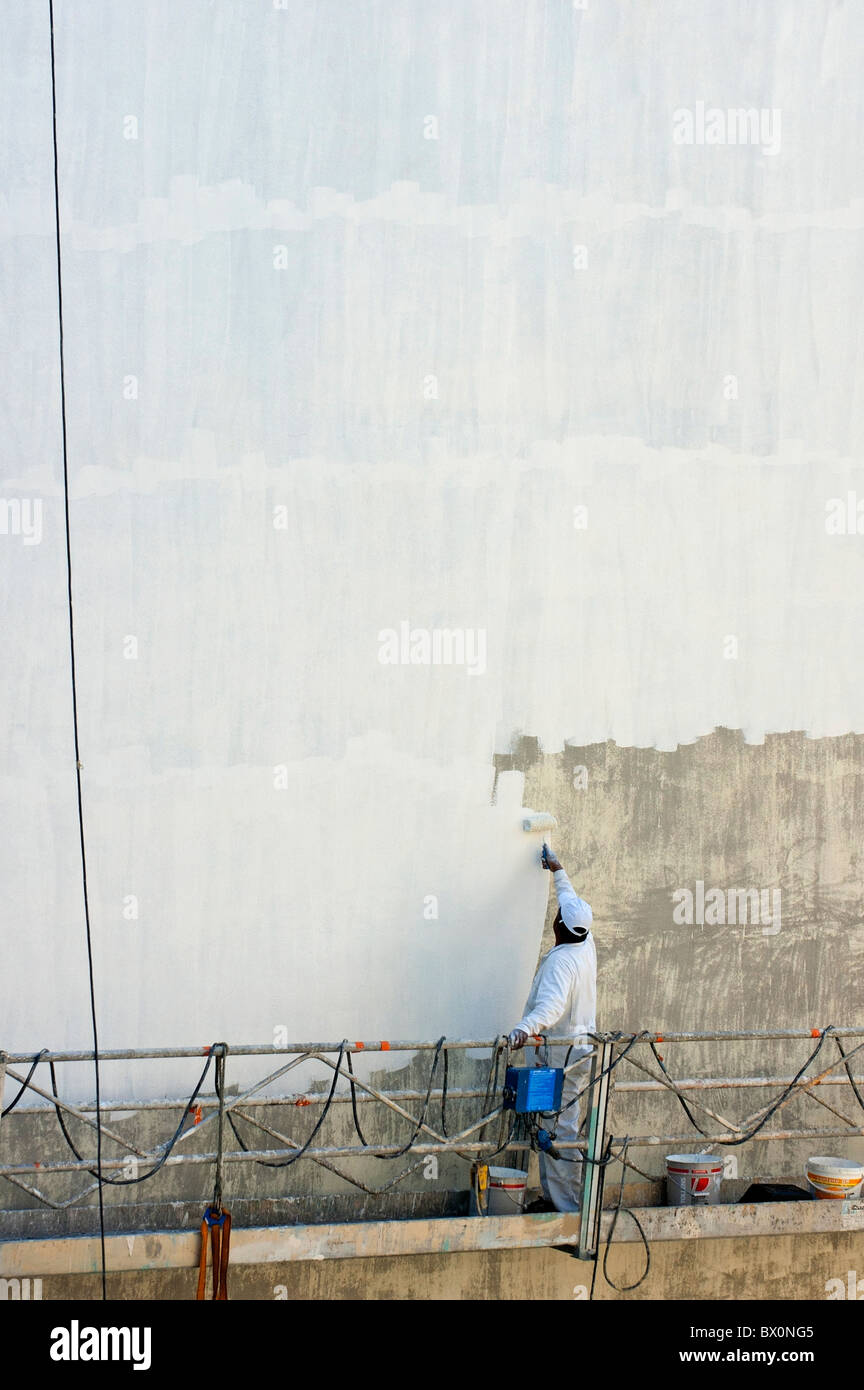 Man painting the facade of a building, Marseille, France. Stock Photo