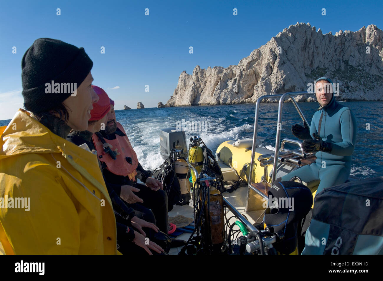 Scuba divers at sea near Maire Island, off the coast of Marseille, France. Stock Photo