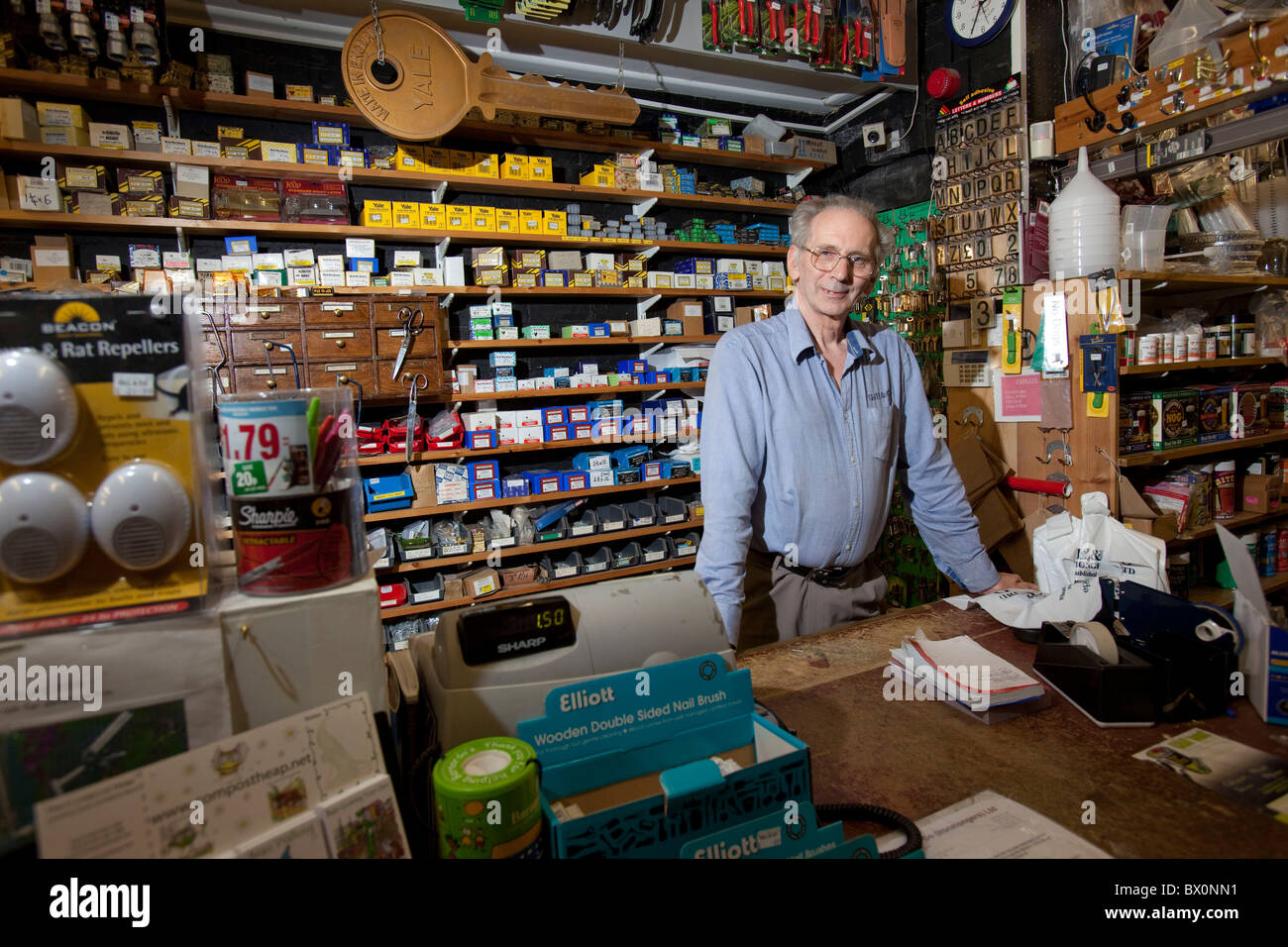 Michael Read 62, serving in Gills in Oxford the country's oldest hardware store Stock Photo