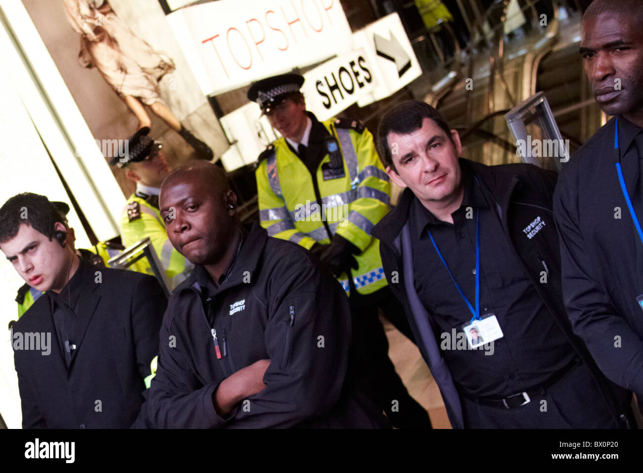 Police and private security guards protect Topshop on Oxford Street during  a ukuncut protest Stock Photo - Alamy