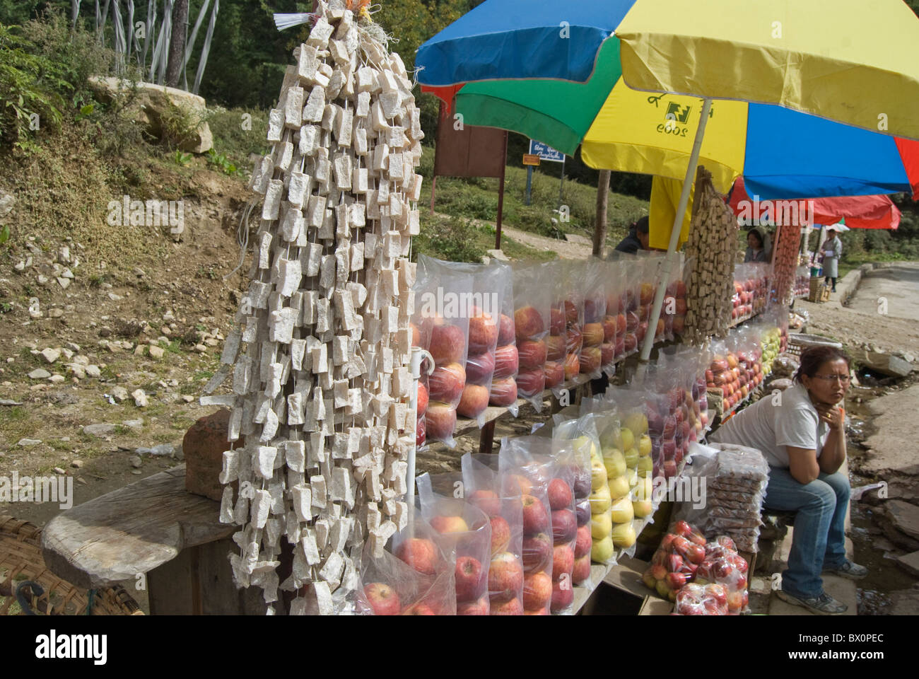 A street shop selling cheese and apples at the checkpoint on the way from Thimphu to Punakha. Stock Photo