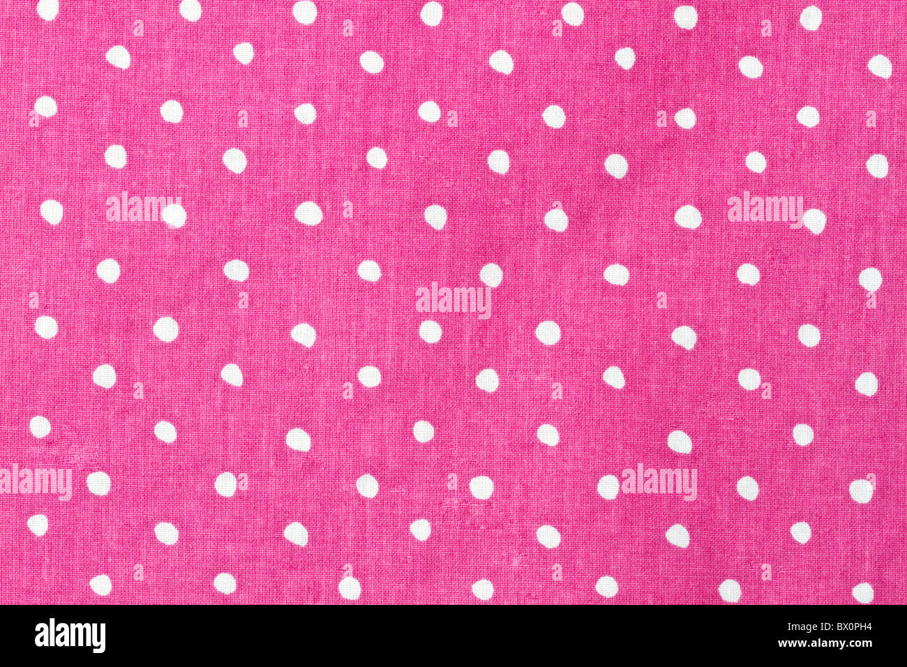 Pink and white dots fabric background Stock Photo