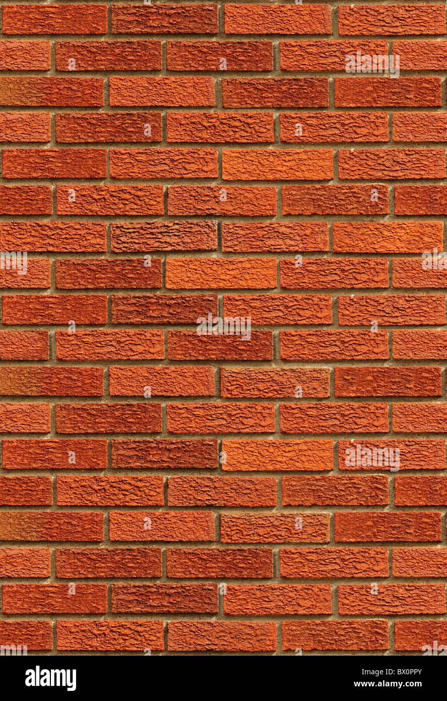 Seamless red brick wall background. The texture repeats seamlessly both vertically and horizontally. Stock Photo