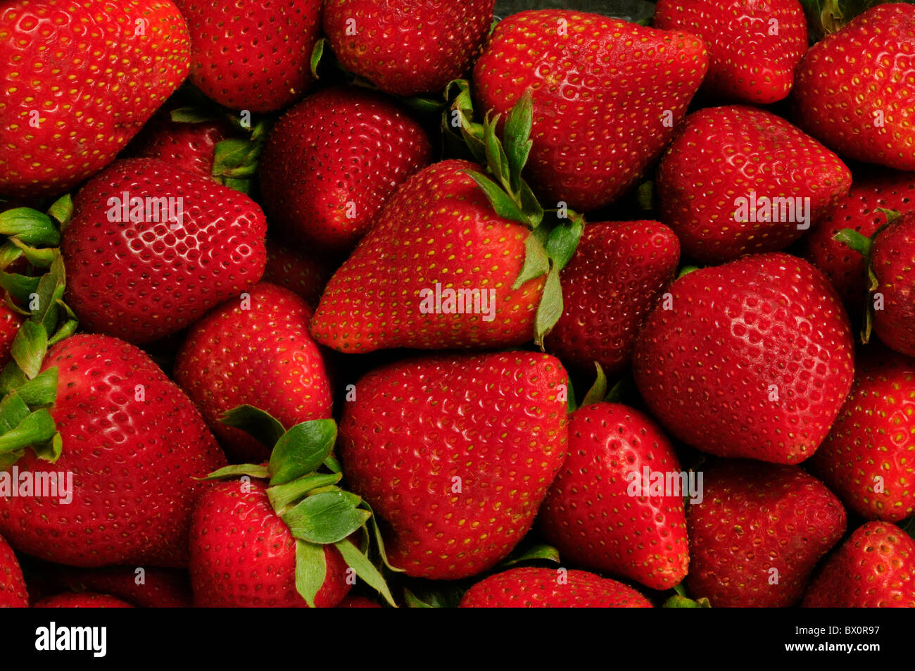 Pile of red strawberries filling frame Stock Photo