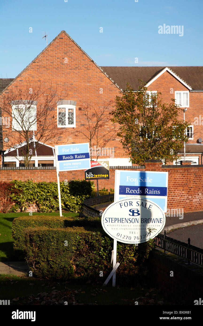 Multiple For sale signs outside private houses or flats Stock Photo