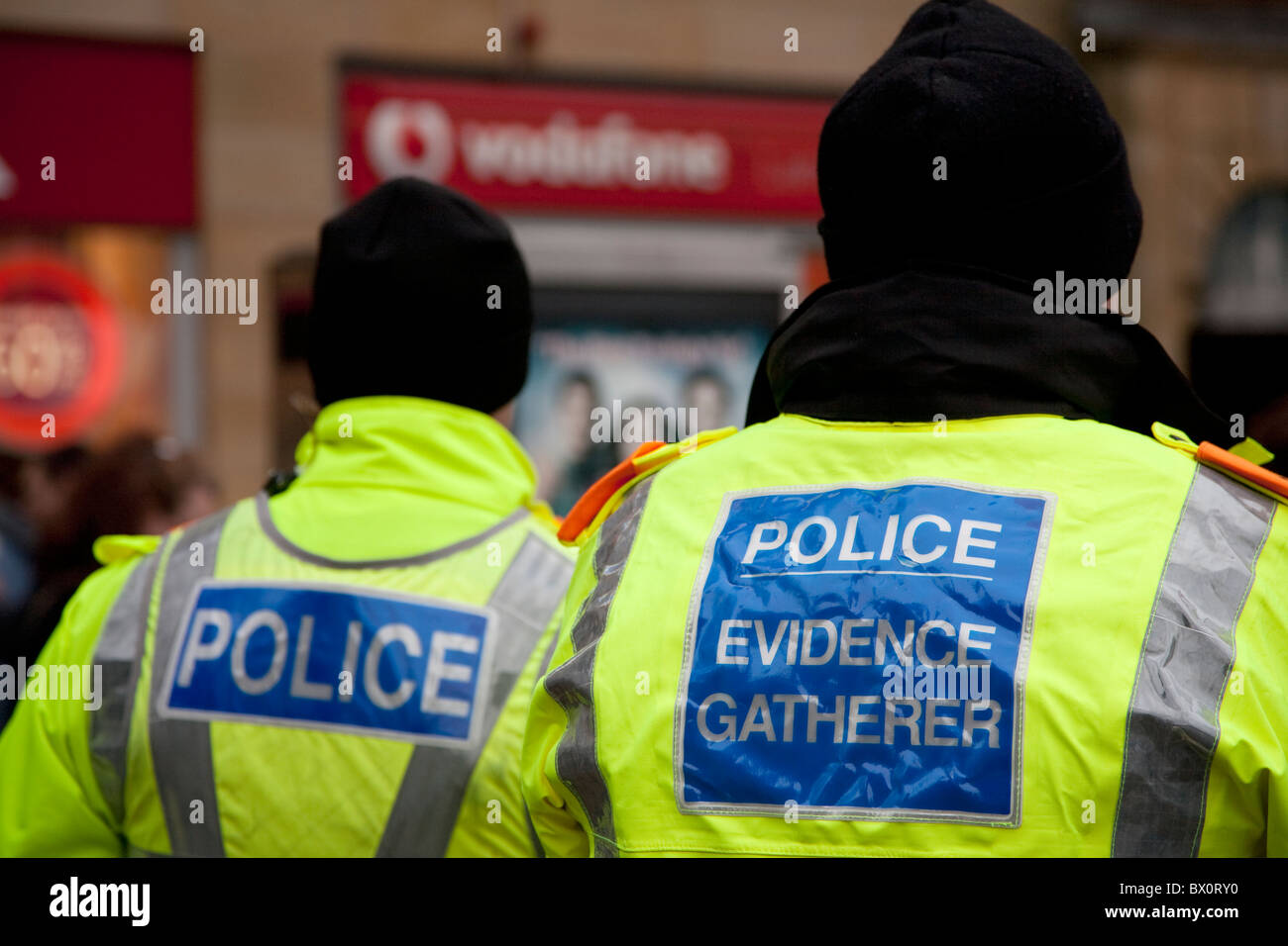 Police stand guard outside a Vodafone store in Lancaster UK during a protest against the Vodafone tax bill that was written off Stock Photo