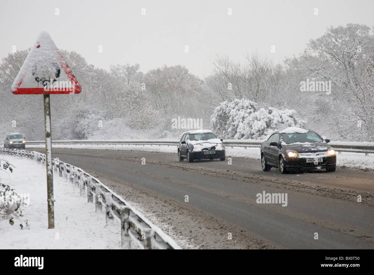 Driving along snowy roads Stock Photo