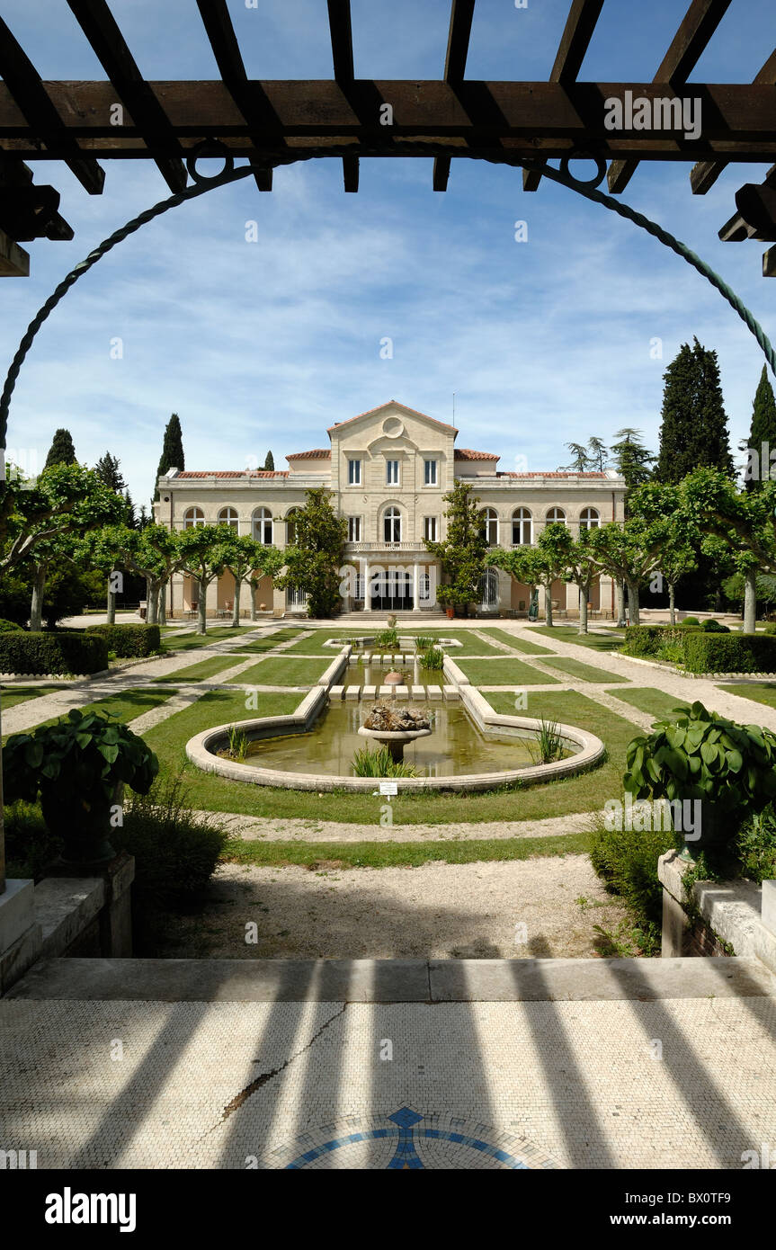Bouillons Château and Formal French Garden with Pool Framed by Pergola, Source Perrier, Vergèze nr Nimes France Stock Photo