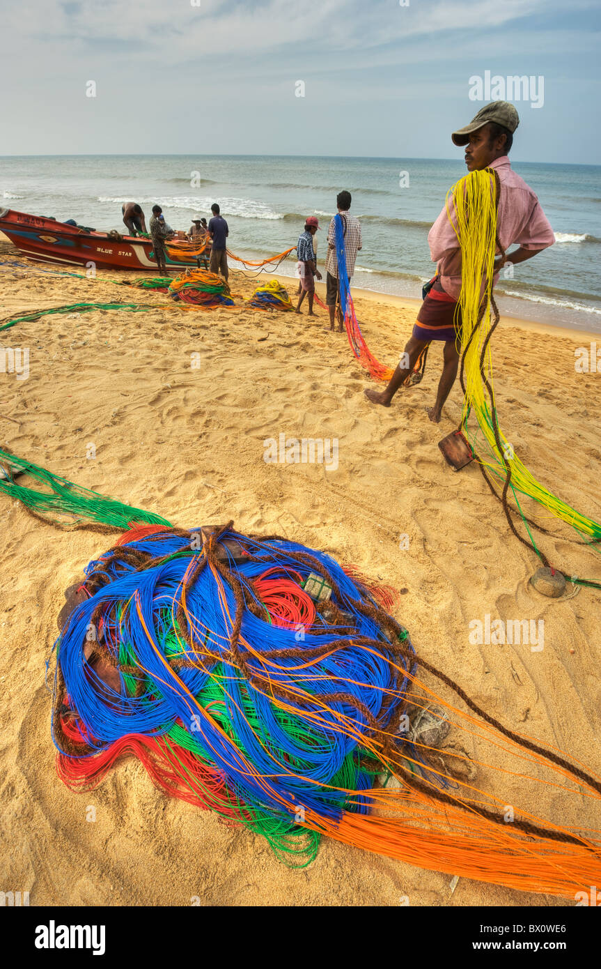 fishermen with colourful fishing nets in southern coast in Sri Lanka