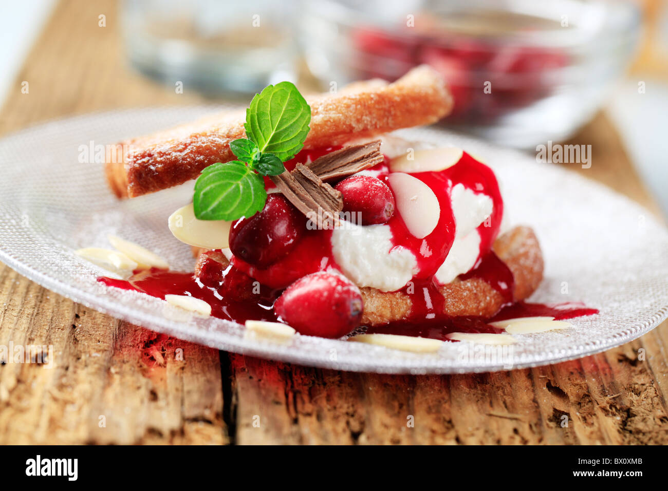 Dessert - Waffles with cream, cranberries and syrup Stock Photo