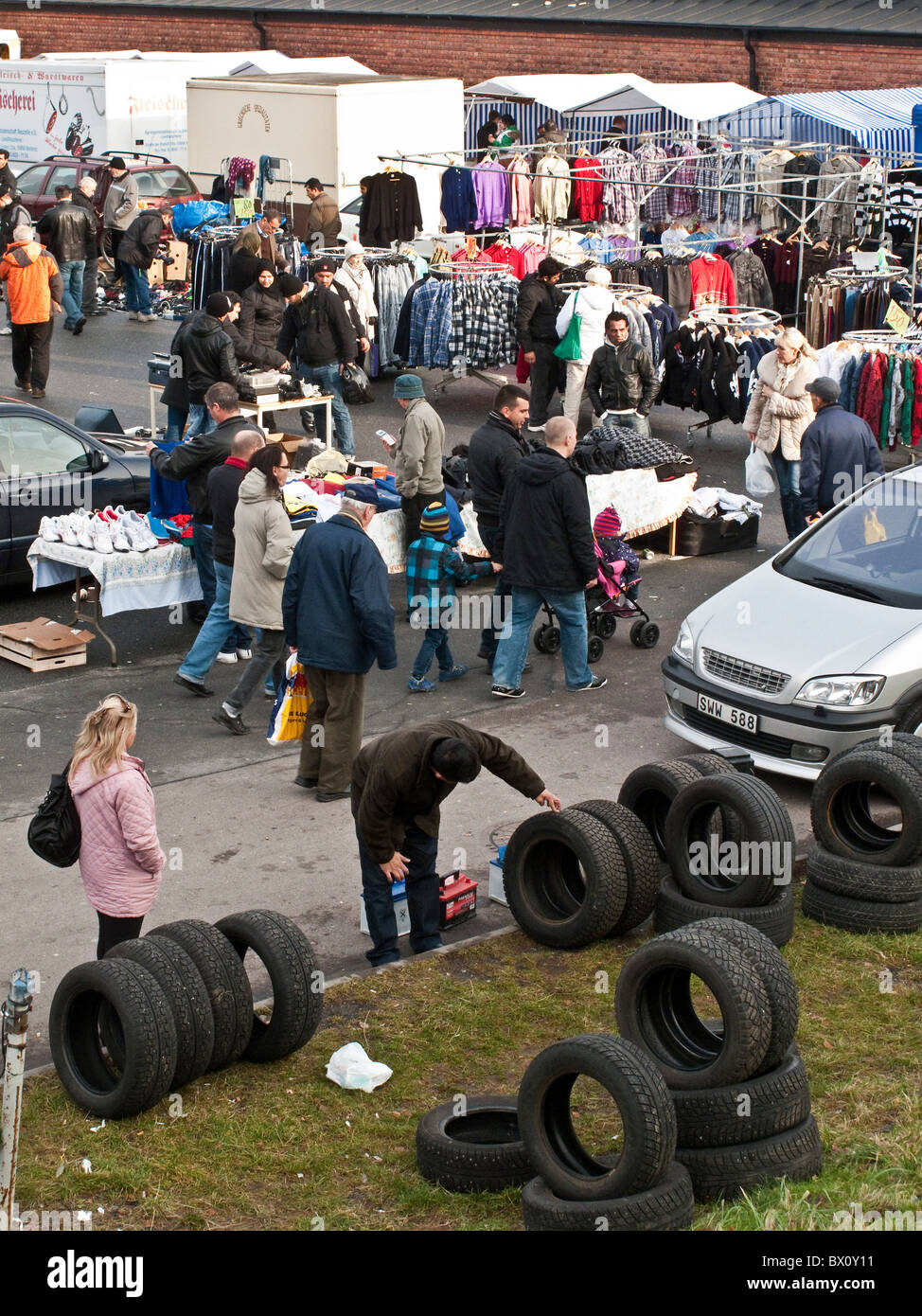 Second hand tires displayed at crowded weekend flea market in outskirt of Gothenburg, Sweden