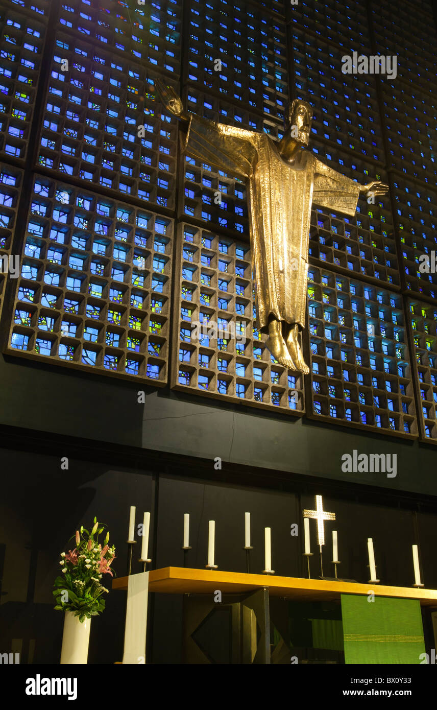 The statue of Christ designed by Karl Hemmeter stands above the altar in the Kaiser Wilhelm memorial church in Berlin, Germany Stock Photo
