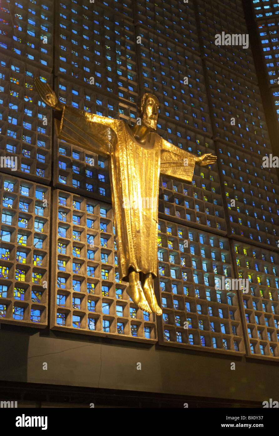 The statue of Christ designed by Karl Hemmeter stands above the altar in the Kaiser Wilhelm memorial church in Berlin, Germany Stock Photo