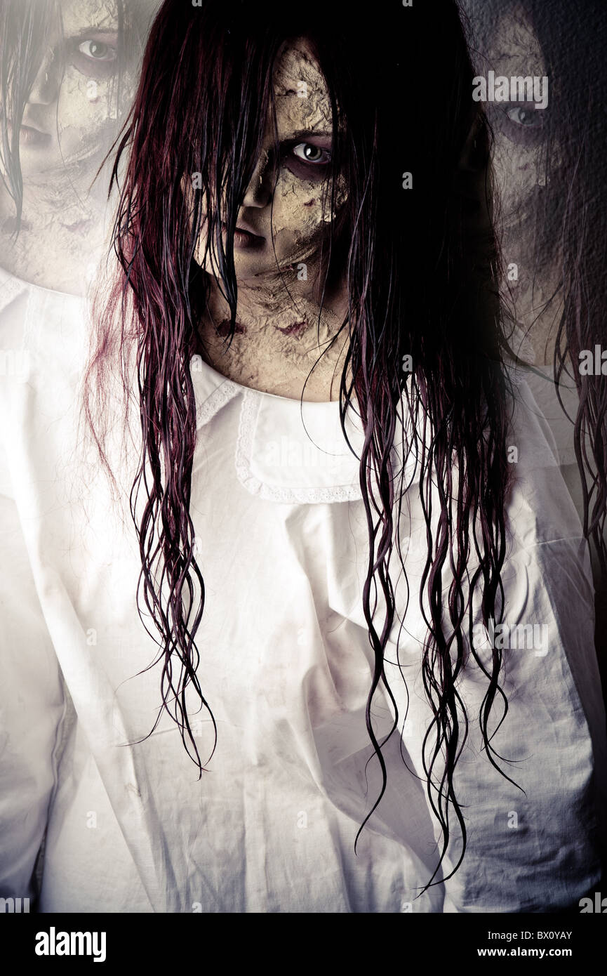 a scary ghost girl wearing a white nightie Stock Photo